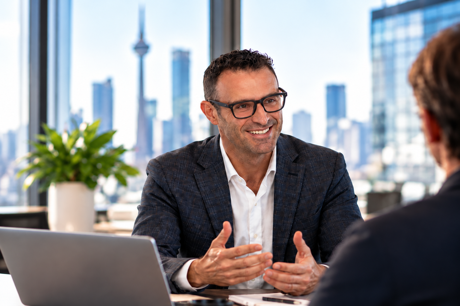 Giancarlo Brotto in conversation with an education leader.